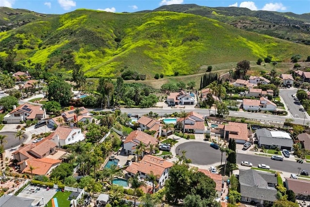28021 Camino Santo Domingo, San Juan Capistrano, CA 92675 - aerial view of property and surrounding area with a mountain backdrop and nearby suburban area