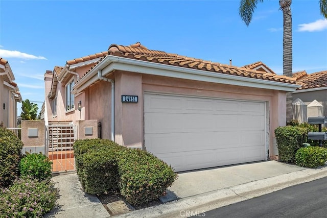 24851 Seagate Dr, Dana Point, CA 92629 - view of front facade with a tile roof, stucco siding, concrete driveway, stairway, and a garage