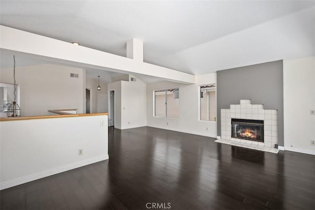 24851 Seagate Dr, Dana Point, CA 92629 - unfurnished living room with vaulted ceiling, wood finished floors, baseboards, and a fireplace