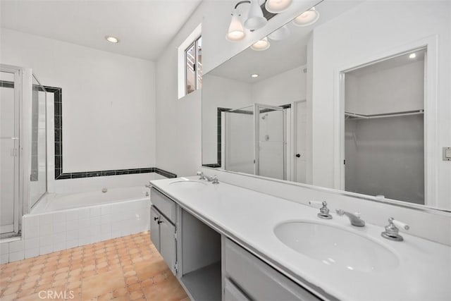 24851 Seagate Dr, Dana Point, CA 92629 - bathroom with a shower stall, a garden tub, a walk in closet, double vanity, and tile patterned flooring