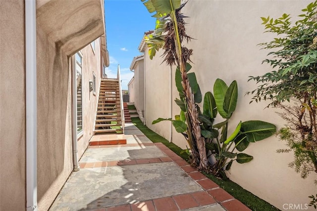 24851 Seagate Dr, Dana Point, CA 92629 - view of home's exterior with stairway and stucco siding