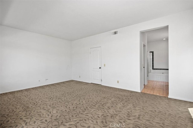 24851 Seagate Dr, Dana Point, CA 92629 - carpeted spare room featuring baseboards