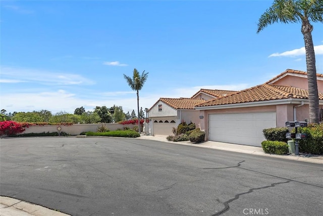 24851 Seagate Dr, Dana Point, CA 92629 - mediterranean / spanish home with stucco siding, a garage, and a tiled roof