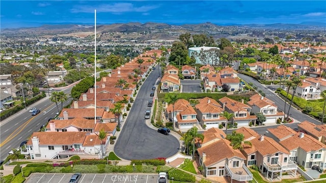 24851 Seagate Dr, Dana Point, CA 92629 - aerial view of property's location with nearby suburban area and a mountainous background