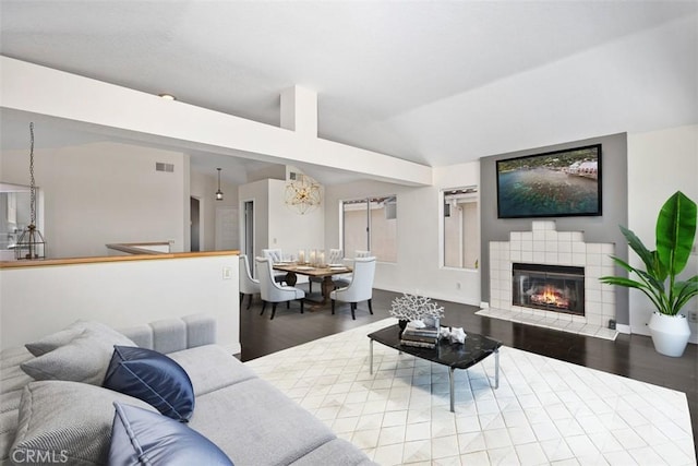 24851 Seagate Dr, Dana Point, CA 92629 - living room featuring wood finished floors, lofted ceiling, and a fireplace