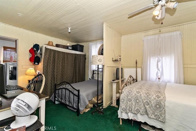 2368 E 107th St, Los Angeles, CA 90002 - bedroom with carpet, wood walls, multiple windows, ceiling fan, and wooden ceiling