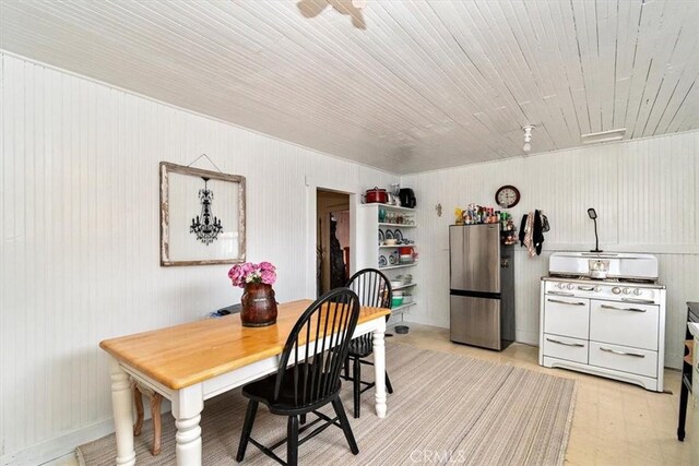2368 E 107th St, Los Angeles, CA 90002 - dining area featuring wooden walls
