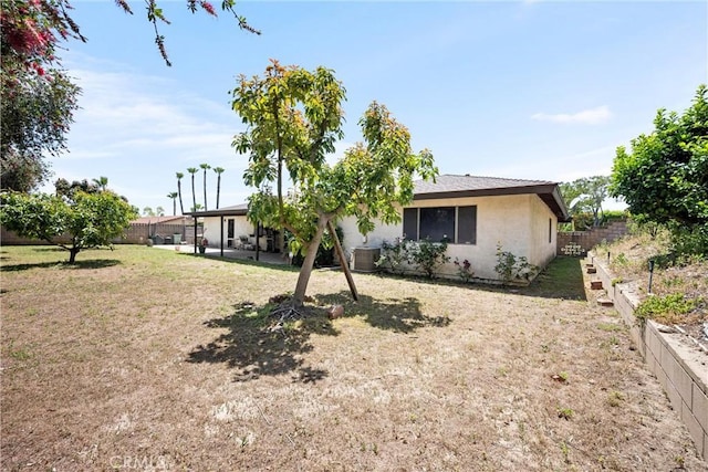 6145 Jasper St, Rancho Cucamonga, CA 91701 - rear view of property featuring stucco siding, cooling unit, and a patio area