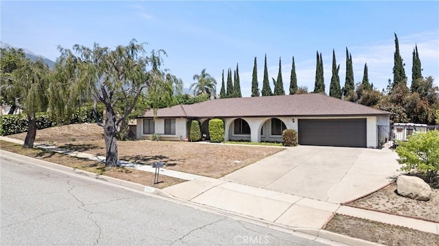 6145 Jasper St, Rancho Cucamonga, CA 91701 - ranch-style house featuring a garage, concrete driveway, and stucco siding