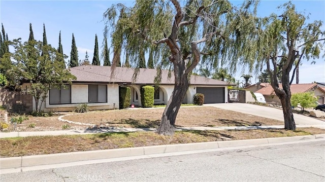 6145 Jasper St, Rancho Cucamonga, CA 91701 - ranch-style house featuring an attached garage, driveway, and stucco siding