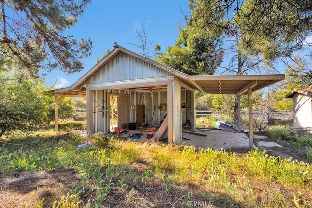 5635 Honeyhill Rd Unit A & B, Oak Hills, CA 92344 - rear view of house with an outdoor structure