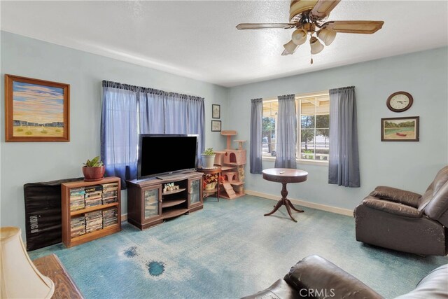 5635 Honeyhill Rd Unit A & B, Oak Hills, CA 92344 - living area with a ceiling fan and carpet flooring