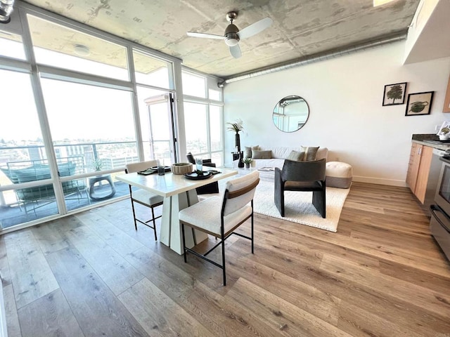 1080 Park Blvd Unit 1514, San Diego, CA 92101 - dining space featuring floor to ceiling windows, wood finished floors, ceiling fan, and baseboards
