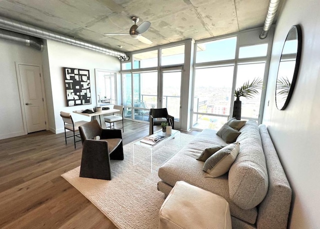 1080 Park Blvd Unit 1514, San Diego, CA 92101 - living room with a ceiling fan, wood finished floors, expansive windows, and baseboards