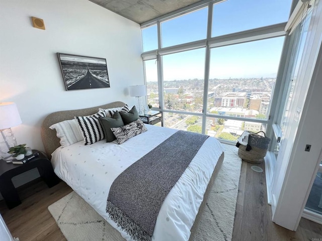 1080 Park Blvd Unit 1514, San Diego, CA 92101 - bedroom with wood finished floors and a view of city
