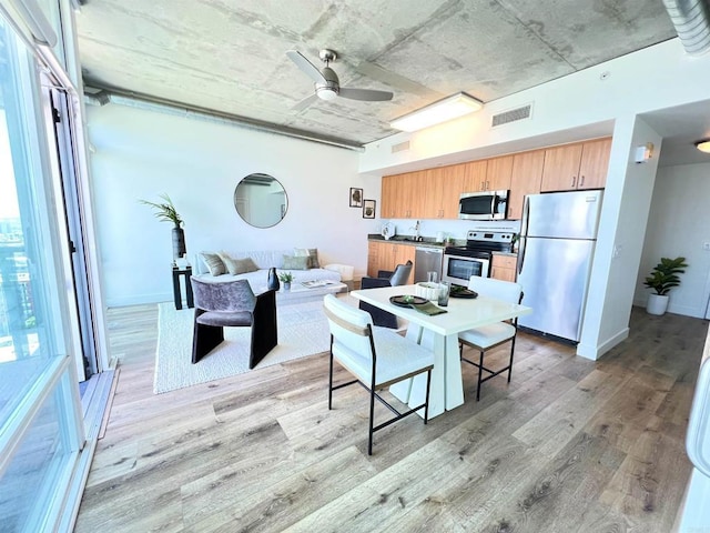 1080 Park Blvd Unit 1514, San Diego, CA 92101 - dining space with light wood-style flooring and ceiling fan