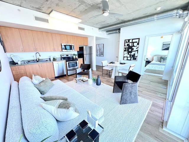 1080 Park Blvd Unit 1514, San Diego, CA 92101 - living area with light wood-style floors and ceiling fan
