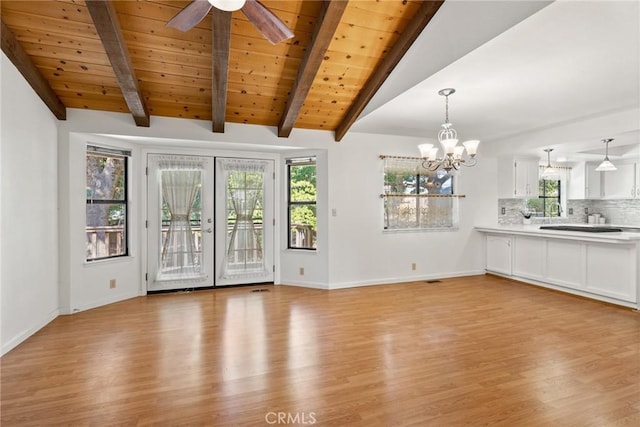 1585 Gate Ln, Paradise, CA 95969 - unfurnished living room featuring light wood-type flooring, healthy amount of natural light, baseboards, a chandelier, and wooden ceiling