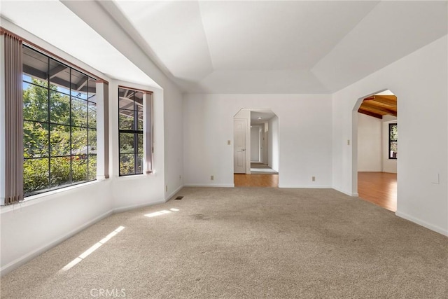 1585 Gate Ln, Paradise, CA 95969 - carpeted spare room featuring healthy amount of natural light, a raised ceiling, arched walkways, and baseboards