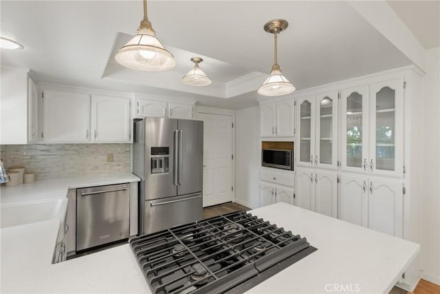 1585 Gate Ln, Paradise, CA 95969 - kitchen featuring stainless steel appliances, white cabinetry, decorative backsplash, and light countertops