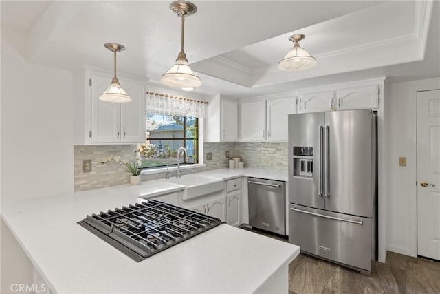 1585 Gate Ln, Paradise, CA 95969 - kitchen featuring stainless steel appliances, a raised ceiling, a sink, white cabinets, and ornamental molding