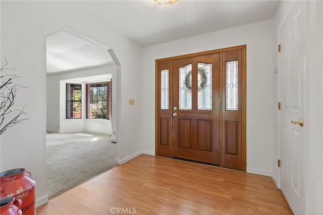 1585 Gate Ln, Paradise, CA 95969 - entryway with light wood-type flooring, baseboards, and arched walkways