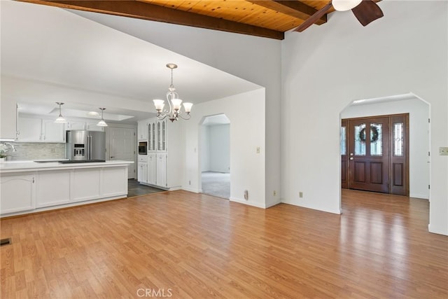 1585 Gate Ln, Paradise, CA 95969 - unfurnished living room featuring arched walkways, light wood-type flooring, a chandelier, a ceiling fan, and wood ceiling