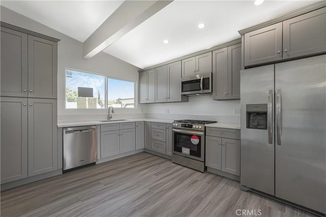 9809 Odessa Ave, North Hills, CA 91343 - kitchen featuring stainless steel appliances, gray cabinetry, light wood-type flooring, light countertops, and recessed lighting