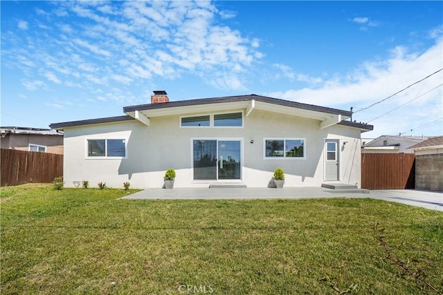 9809 Odessa Ave, North Hills, CA 91343 - rear view of property featuring stucco siding and a chimney