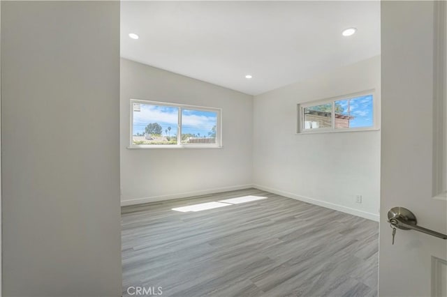 9809 Odessa Ave, North Hills, CA 91343 - empty room featuring healthy amount of natural light, baseboards, recessed lighting, and wood finished floors