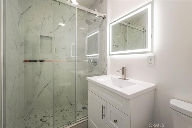 9809 Odessa Ave, North Hills, CA 91343 - full bathroom with toilet, vanity, and a marble finish shower