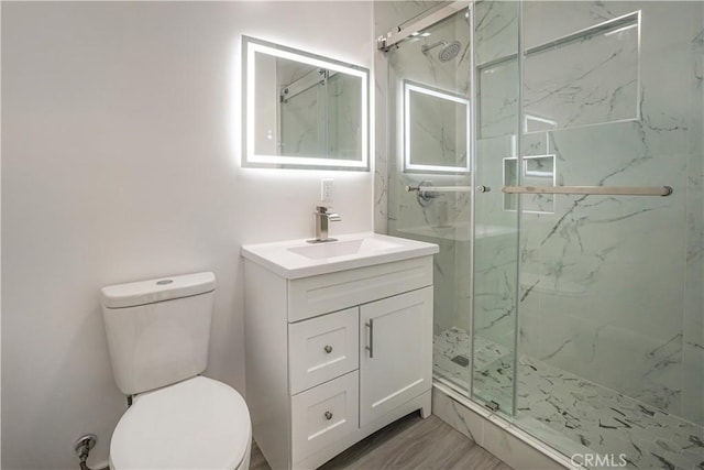 9809 Odessa Ave, North Hills, CA 91343 - full bath with a marble finish shower, toilet, and vanity