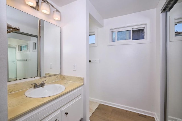 723 Fresca Ct, Solana Beach, CA 92075 - bathroom with vanity, wood finished floors, and baseboards