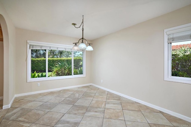 723 Fresca Ct, Solana Beach, CA 92075 - spare room featuring plenty of natural light, arched walkways, and baseboards