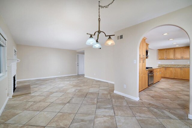 723 Fresca Ct, Solana Beach, CA 92075 - unfurnished living room with arched walkways, a fireplace, and recessed lighting