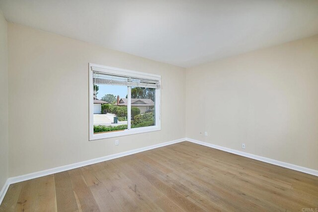 723 Fresca Ct, Solana Beach, CA 92075 - empty room with wood finished floors and baseboards