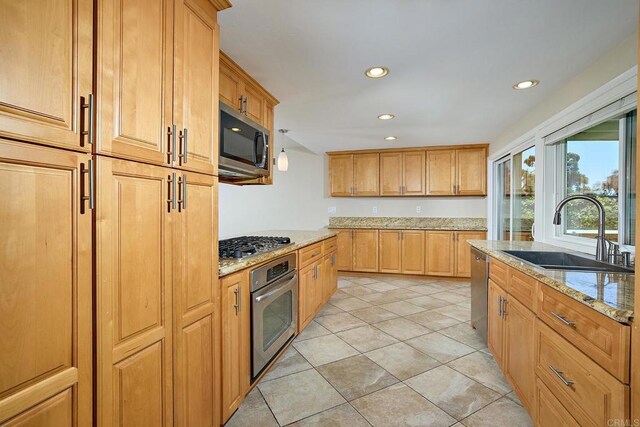 723 Fresca Ct, Solana Beach, CA 92075 - kitchen with stainless steel appliances, light stone counters, recessed lighting, and light tile patterned floors