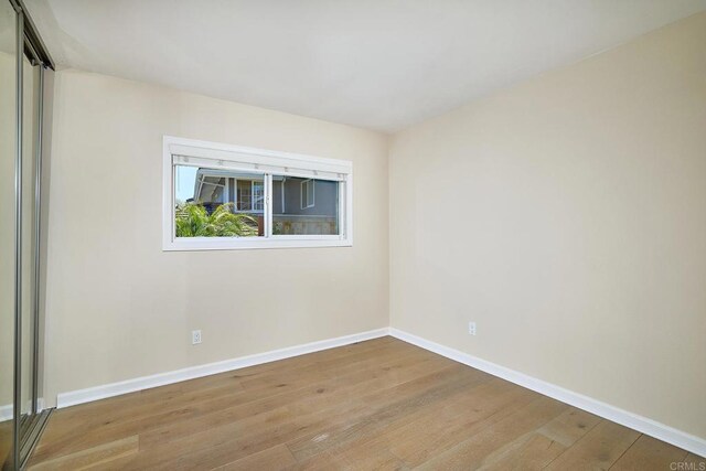723 Fresca Ct, Solana Beach, CA 92075 - empty room with wood finished floors and baseboards