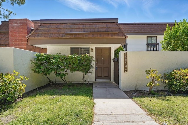 10072 Larwin Ave Unit 2, Chatsworth, CA 91311 - property entrance featuring stucco siding and mansard roof