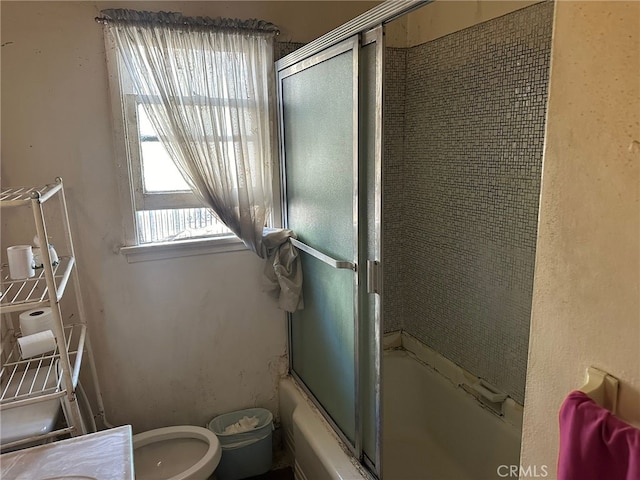 2549 Kansas Ave, South Gate, CA 90280 - full bathroom with toilet and bath / shower combo with glass door