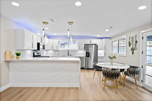 13824 Powers Rd, Poway, CA 92064 - kitchen with appliances with stainless steel finishes, a peninsula, baseboards, light wood-type flooring, and recessed lighting