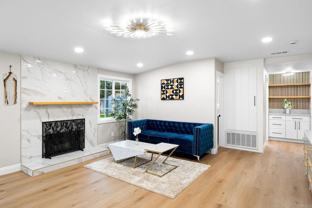 13824 Powers Rd, Poway, CA 92064 - living room with recessed lighting, light wood finished floors, and a fireplace