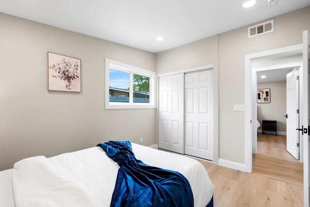 13824 Powers Rd, Poway, CA 92064 - bedroom featuring light wood-type flooring, recessed lighting, baseboards, and a closet