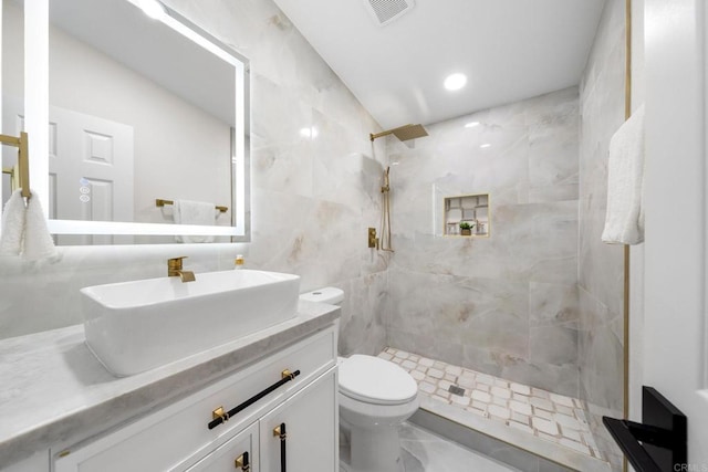 13824 Powers Rd, Poway, CA 92064 - full bath with tiled shower, vanity, toilet, and tile walls
