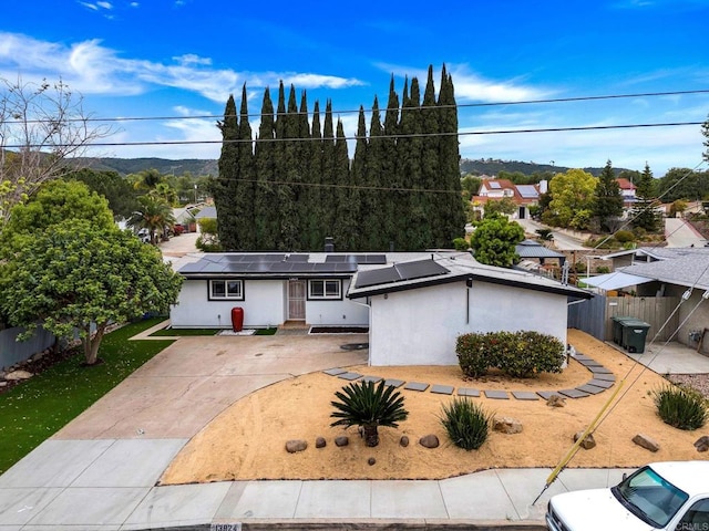 13824 Powers Rd, Poway, CA 92064 - ranch-style home with roof mounted solar panels and concrete driveway