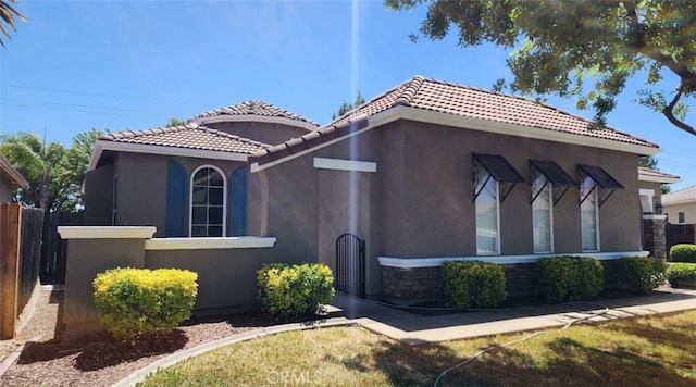 10372 Christo Way, Elk Grove, CA 95757 - view of front of property featuring a tiled roof, stucco siding, and stone siding