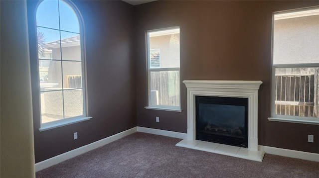 10372 Christo Way, Elk Grove, CA 95757 - unfurnished living room featuring carpet, baseboards, and a glass covered fireplace