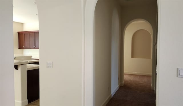 10372 Christo Way, Elk Grove, CA 95757 - hall featuring arched walkways, light colored carpet, and baseboards