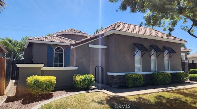 10372 Christo Way, Elk Grove, CA 95757 - view of front of property with a tiled roof, stucco siding, and stone siding