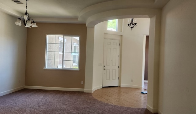 10372 Christo Way, Elk Grove, CA 95757 - carpeted foyer with a chandelier, baseboards, and tile patterned flooring